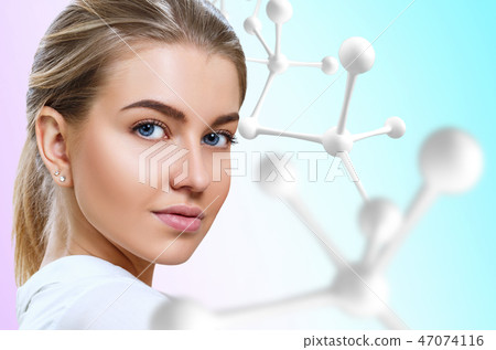 Beautiful woman near big white molecule chain. 47074116
