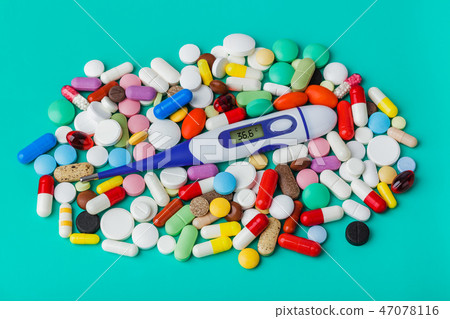 Pills and thermometer (36.6) - medical background Pills and thermometer (36.6) - medical background 47078116