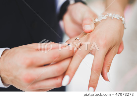 Bride and groom exchanging wedding rings. Stylish couple official ceremony 47078278