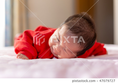 A prone baby 47079727