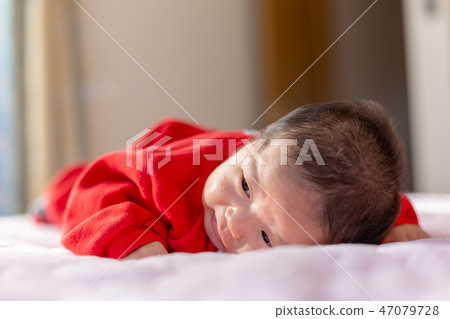 A prone baby 47079728