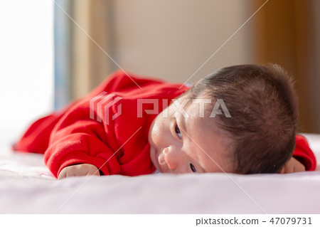 A prone baby A prone baby 47079731