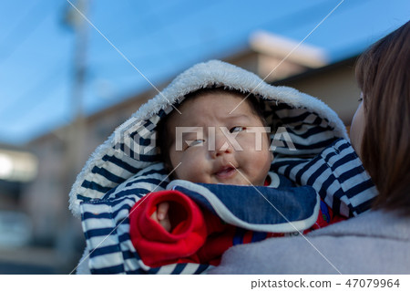Parent and child taking a walk 47079964