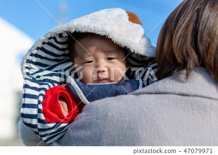 Parent and child taking a walk Parent and child taking a walk 47079971