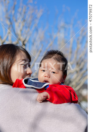 Parent and child taking a walk 47079972