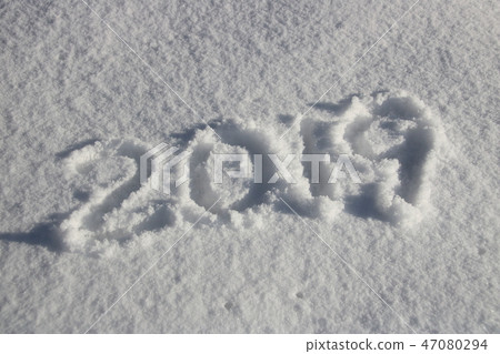 "2019" written on snow cover. 47080294