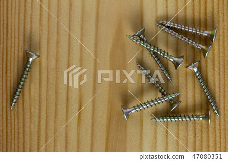 Close-up on screws, metal screws, iron screws Close-up on screws, metal screws, iron screws 47080351