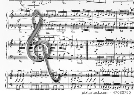 Treble clef on music sheet - musical background Treble clef on music sheet - musical background 47080790