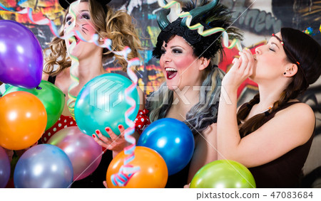 Young women celebrating German fasching Carnival at Rose Monday  47083684