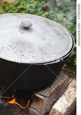 Cauldron stands on a bonfire Cauldron stands on a bonfire 47083689