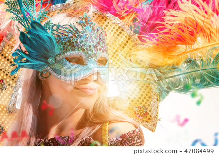 Beautiful young woman in carnival mask 47084499