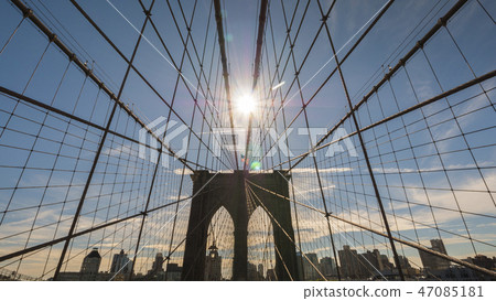 The sun shines over the Brooklyn Bridge in New York The sun shines over the Brooklyn Bridge in New York 47085181