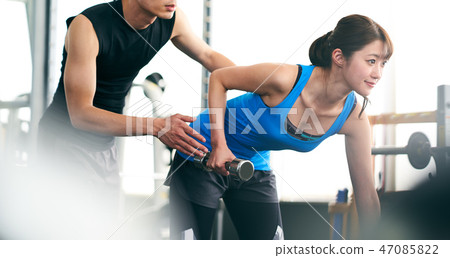 Trainers and women who train their arms 47085822