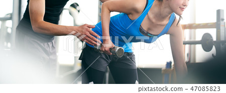 Trainers and women who train their arms Trainers and women who train their arms 47085823