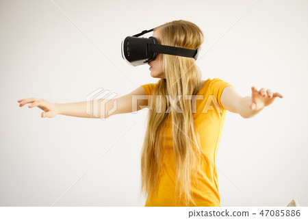 Girl wearing virtual reality goggles. Girl wearing virtual reality goggles. 47085886