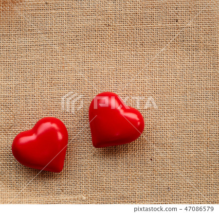 Red ball heart on the sackcloth Red ball heart on the sackcloth 47086579