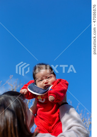 Parent and child taking a walk Parent and child taking a walk 47086876