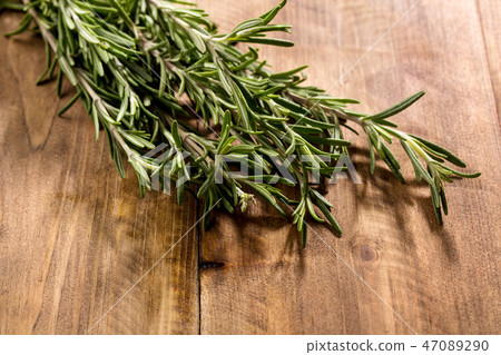 rosemary on a wooden board 47089290