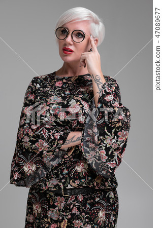 Portrait of young blonde girl with glasses isolated on light background Portrait of young blonde girl with glasses isolated on light background 47089677