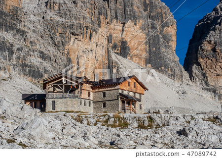 Mountain landscape and alpine hut  47089742