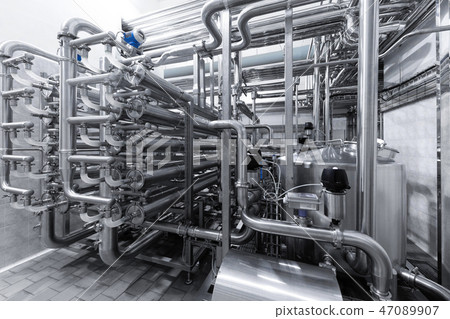Industrial pipelines and modern equipment in cheese production interior 47089907