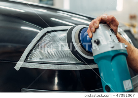 Auto detailing, worker with polishing machine 47091007