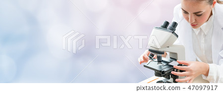 Scientist researcher uses microscope in laboratory 47097917