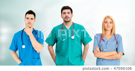Doctor working in hospital with other doctors. 47098106