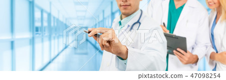 Doctor working in hospital with other doctors. Doctor working in hospital with other doctors. 47098254
