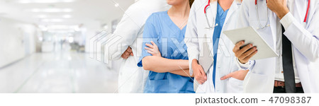 Doctor working in hospital with other doctors. Doctor working in hospital with other doctors. 47098387
