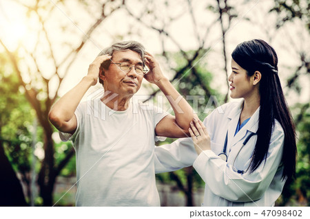 Friendly doctor taking care of senior man. 47098402