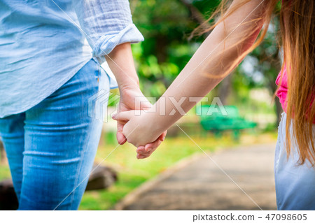 Happy mother and little kid daughter in park. Happy mother and little kid daughter in park. 47098605