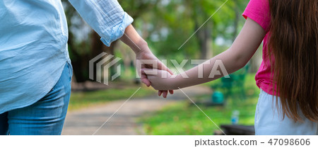 Happy mother and little kid daughter in park. Happy mother and little kid daughter in park. 47098606