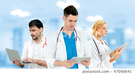Doctor working in hospital with other doctors. 47098641
