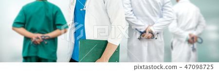 Doctor working in hospital with other doctors. Doctor working in hospital with other doctors. 47098725