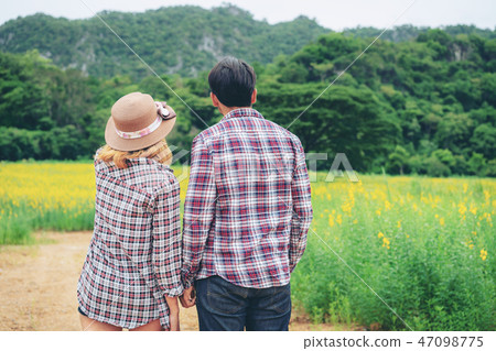 Happy couple take a romantic walk on the hills. Happy couple take a romantic walk on the hills. 47098775
