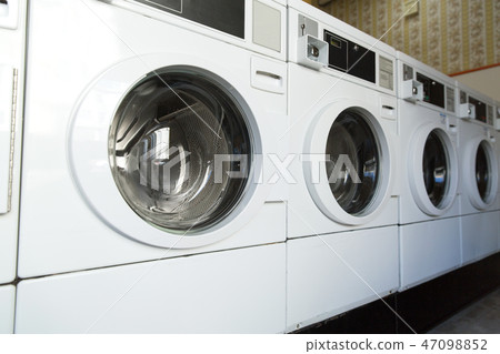 washing machines at laundromat 47098852