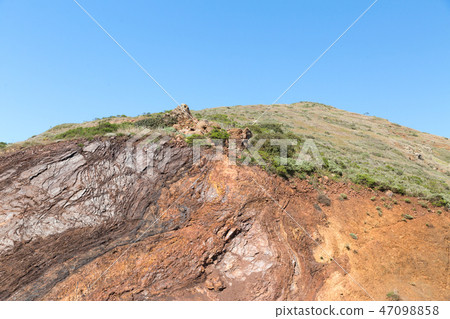 close up of hill or mountain over blue sky 47098858