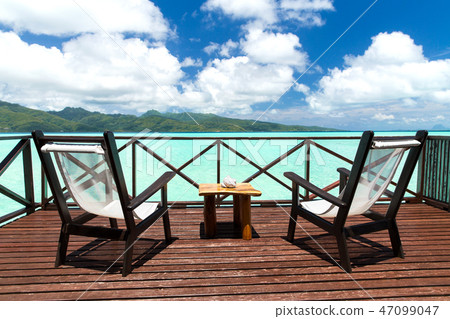 two chaise longues on terrace in french polynesia 47099047