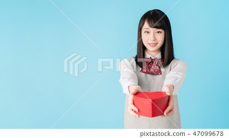 High school girl passing heart High school girl passing heart 47099678