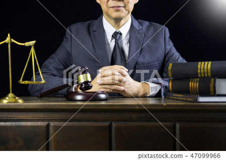 justice and law concept.Male judge in a courtroom working on woo justice and law concept.Male judge in a courtroom working on woo 47099966