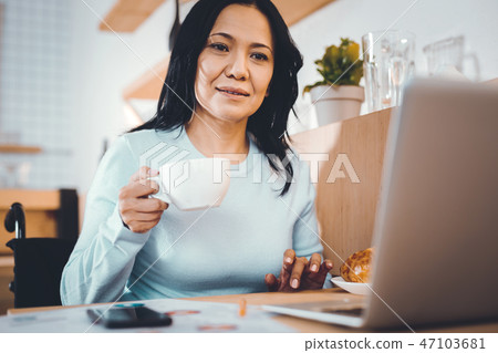 Tired woman working remotely 47103681