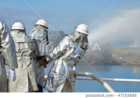 Firefighters demonstrating water cannons at the New Year's parade Firefighters demonstrating water cannons at the New Year's parade 47103688