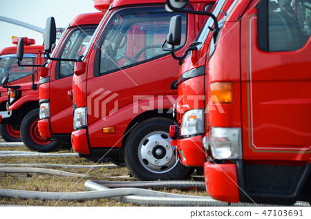 Fire trucks lined up in a row at the New Year's parade 47103691