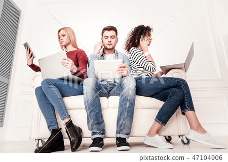Smart serious people using modern gadgets 47104906