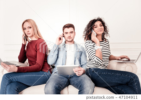 Pleasant young people looking at you 47104911
