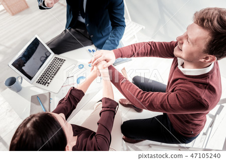 Optimistic three colleagues aiming at success 47105240