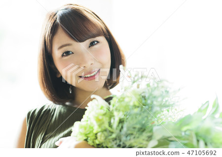 Woman flower bouquet botanical flower arrangement 47105692