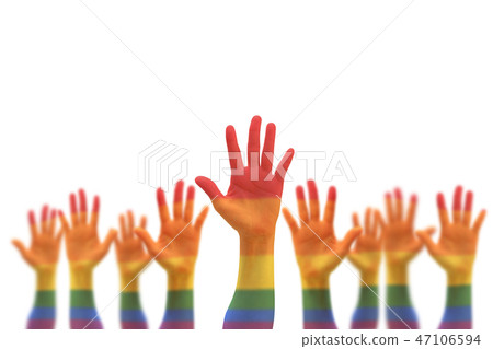 Rainbow multi-color flag on blur many people hands Rainbow multi-color flag on blur many people hands 47106594