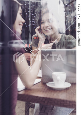 Pleased females spending break together Pleased females spending break together 47106635